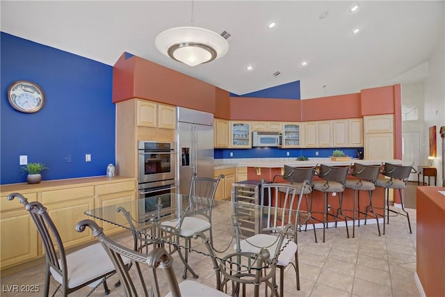 dining space featuring recessed lighting, high vaulted ceiling, visible vents, and light tile patterned floors