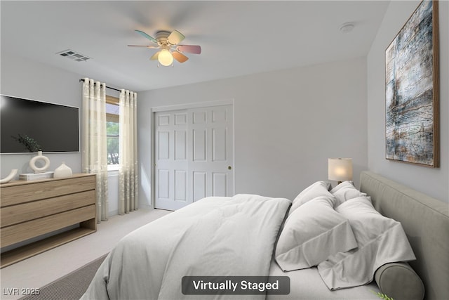bedroom featuring light carpet, a closet, a ceiling fan, and visible vents