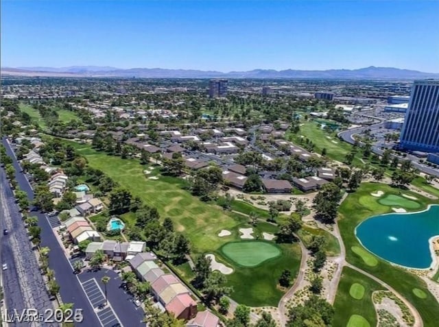 aerial view with a residential view, golf course view, and a water and mountain view