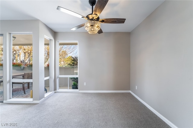 unfurnished room featuring baseboards, ceiling fan, and carpet floors