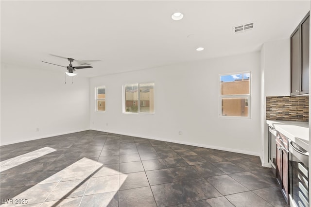 10525 Shiny Skies Dr, Las Vegas, NV 89129 - interior space featuring beverage cooler, a ceiling fan, baseboards, recessed lighting, and visible vents
