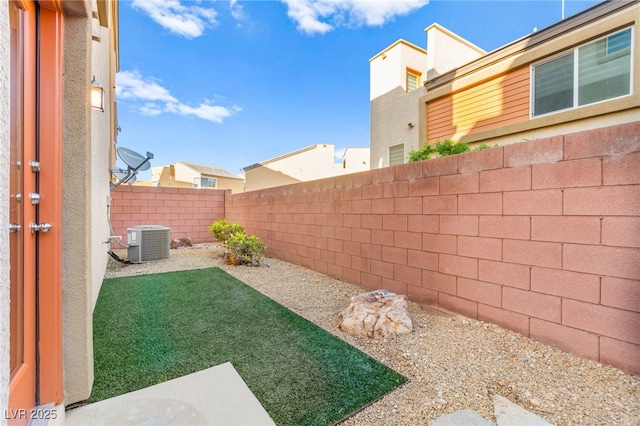 10525 Shiny Skies Dr, Las Vegas, NV 89129 - view of yard featuring cooling unit and a fenced backyard