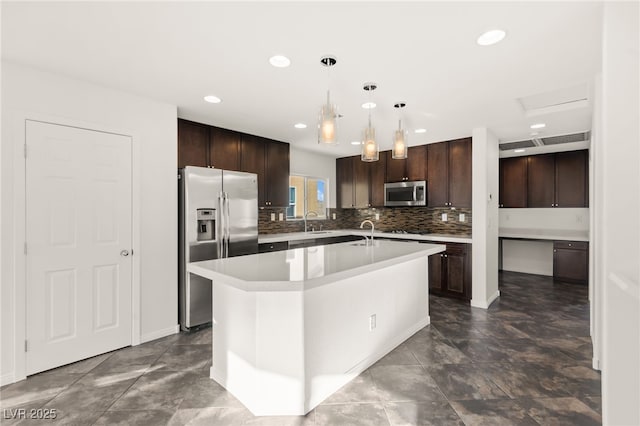 10525 Shiny Skies Dr, Las Vegas, NV 89129 - kitchen featuring light countertops, stainless steel appliances, a sink, and dark brown cabinets