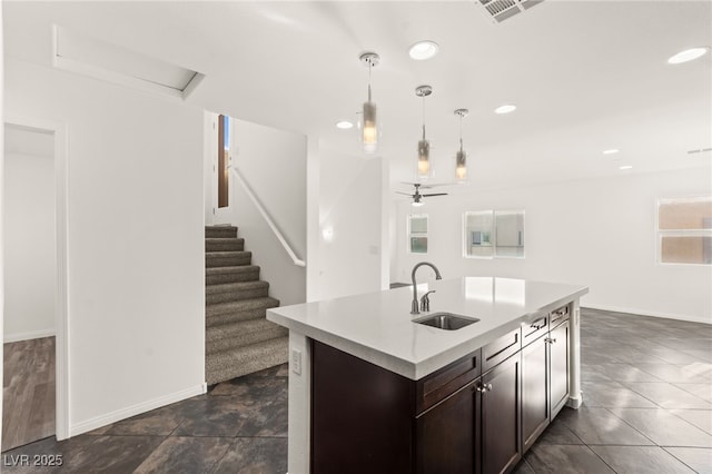 10525 Shiny Skies Dr, Las Vegas, NV 89129 - kitchen featuring visible vents, pendant lighting, ceiling fan, light countertops, and a sink