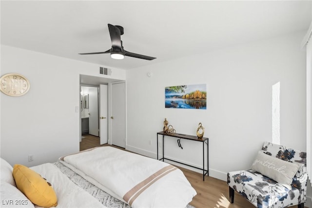 3425 E Russell Rd Unit 202, Las Vegas, NV 89120 - bedroom featuring wood finished floors, a ceiling fan, and baseboards