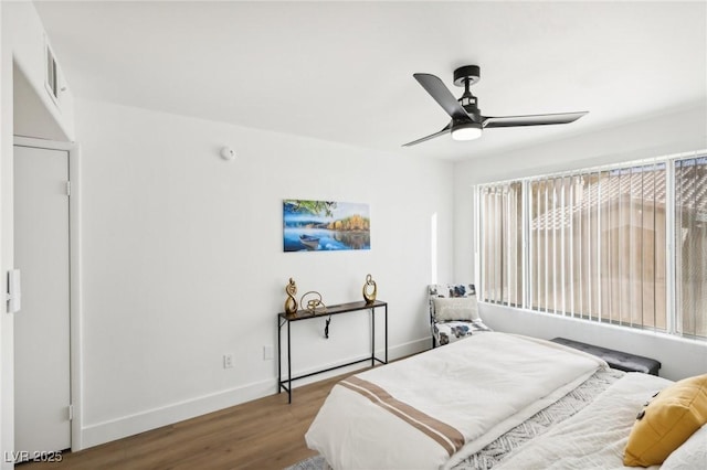 3425 E Russell Rd Unit 202, Las Vegas, NV 89120 - bedroom with wood finished floors, baseboards, and ceiling fan
