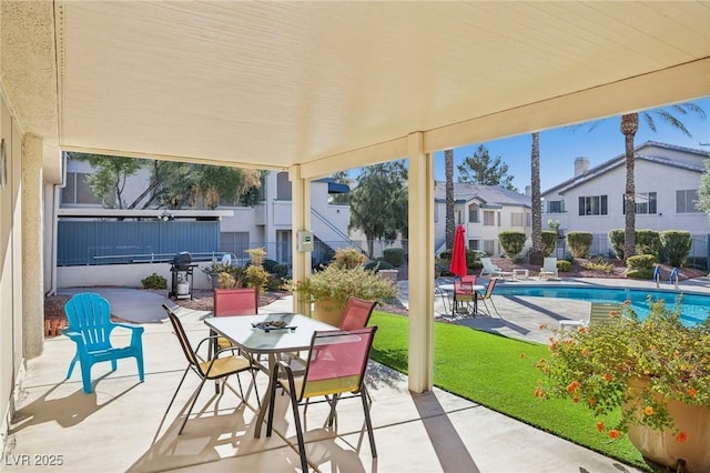 3425 E Russell Rd Unit 202, Las Vegas, NV 89120 - view of patio with outdoor dining space and fence