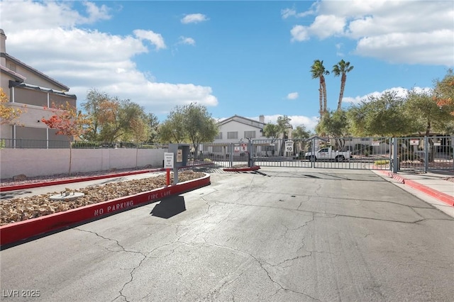 3425 E Russell Rd Unit 202, Las Vegas, NV 89120 - view of asphalt street featuring a gate, curbs, a gated entry, and sidewalks