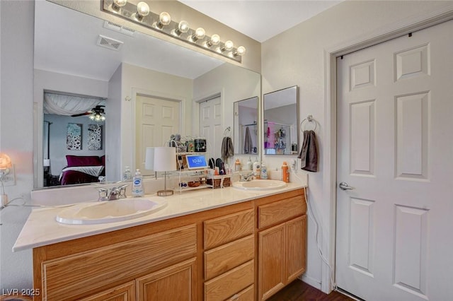 1007 Shades End Ave, North Las Vegas, NV 89081 - ensuite bathroom with double vanity and a ceiling fan