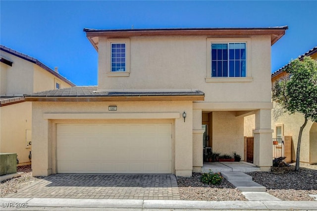 1007 Shades End Ave, North Las Vegas, NV 89081 - view of front of home featuring stucco siding and driveway