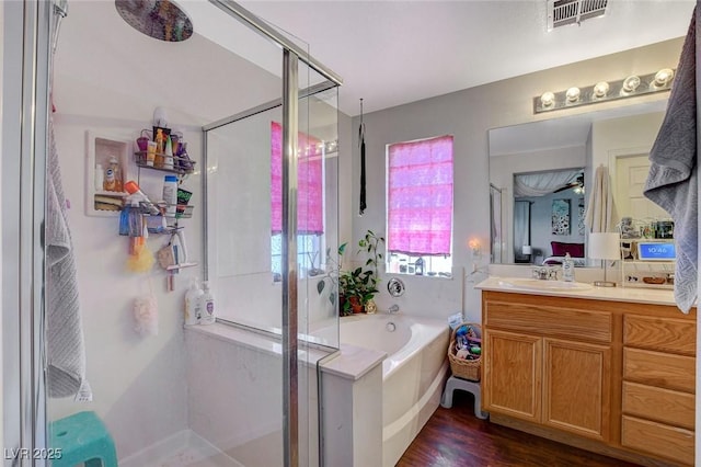 1007 Shades End Ave, North Las Vegas, NV 89081 - full bath featuring a shower stall, vanity, a bath, and wood finished floors
