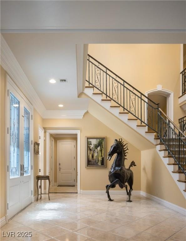 entryway with stairway and baseboards