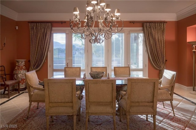 dining room featuring baseboards, a chandelier, ornamental molding, and a wealth of natural light