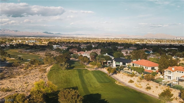 aerial view featuring a residential view, a mountain view, and golf course view
