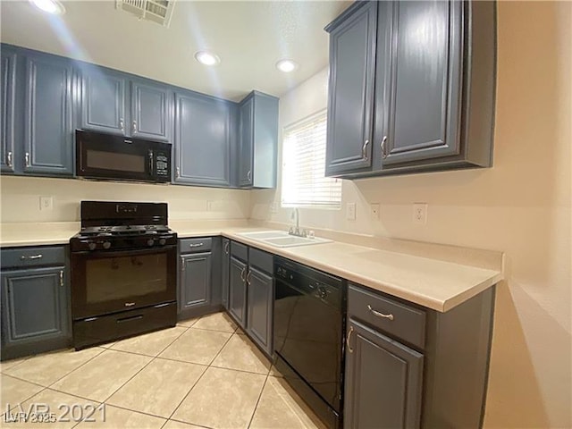 kitchen featuring visible vents, a sink, light countertops, light tile patterned floors, and black appliances
