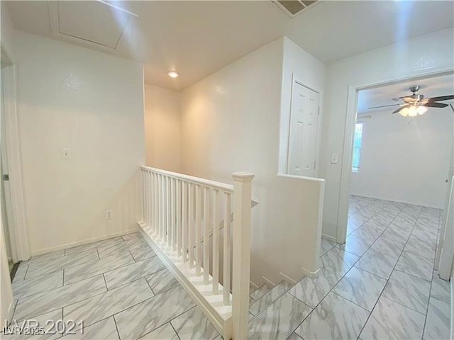 corridor featuring visible vents, marble finish floor, baseboards, recessed lighting, and an upstairs landing
