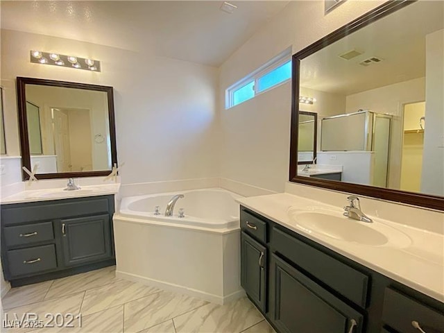 bathroom with two vanities, a sink, a bath, and a stall shower