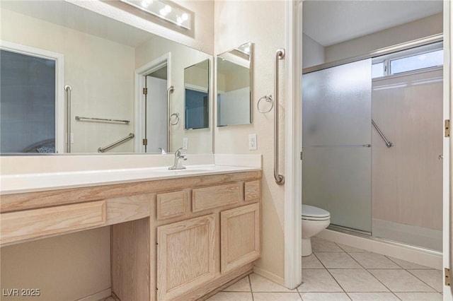 8901 Litchfield Ave, Las Vegas, NV 89134 - bathroom with vanity, toilet, a shower stall, and tile patterned floors