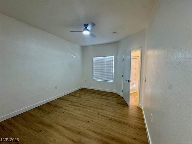 3400 Cabana Dr Unit 1033, Las Vegas, NV 89122 - empty room with baseboards, wood finished floors, and a ceiling fan