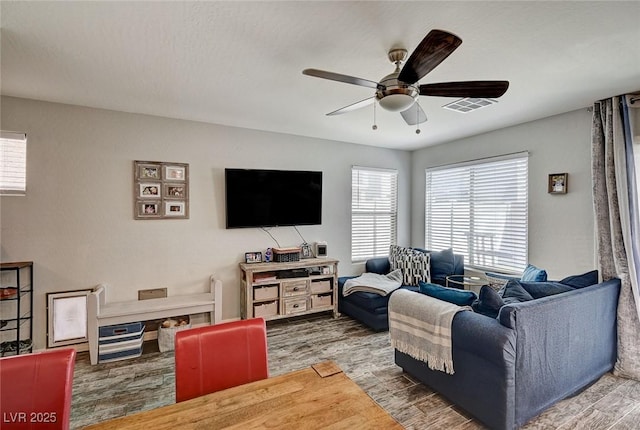6231 Portland Treaty Ave, Las Vegas, NV 89122 - living area with a ceiling fan, visible vents, and wood finished floors