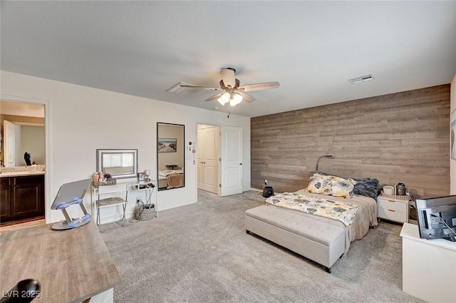6231 Portland Treaty Ave, Las Vegas, NV 89122 - bedroom featuring carpet flooring, wooden walls, a ceiling fan, and visible vents