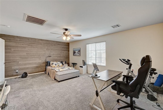 6231 Portland Treaty Ave, Las Vegas, NV 89122 - carpeted bedroom with wood walls, visible vents, and ceiling fan