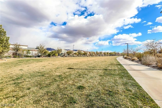 view of home's community featuring a lawn