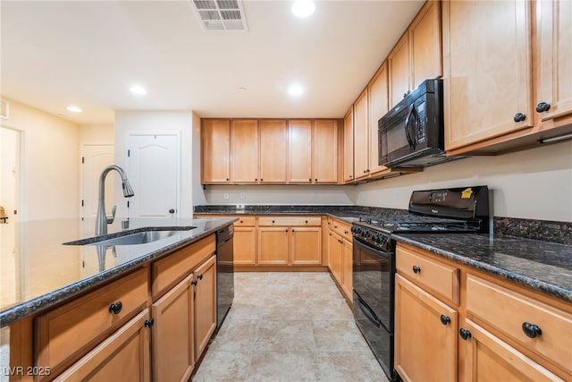 kitchen featuring visible vents, recessed lighting, dark stone counters, a sink, and black appliances