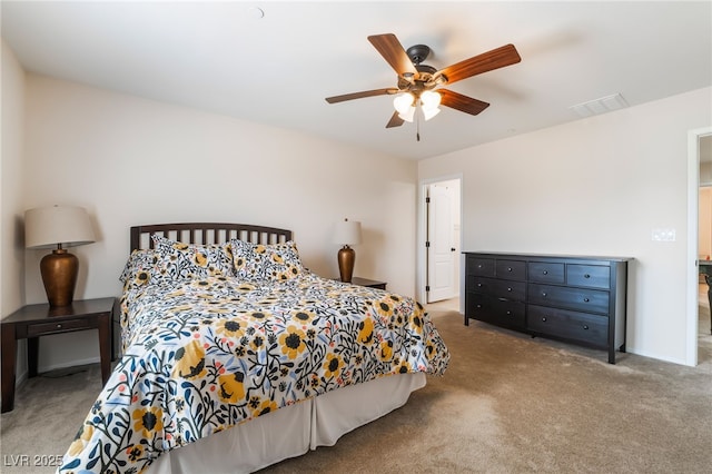 bedroom with visible vents, carpet flooring, and ceiling fan