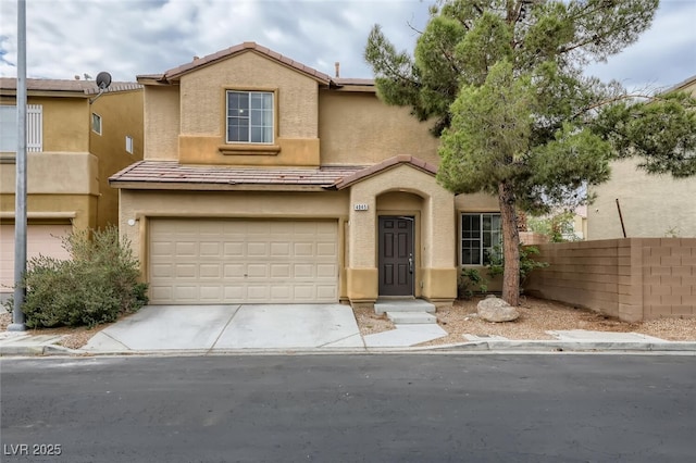 4045 Oliver Sagebrush Dr, Las Vegas, NV 89122 - view of front of house featuring fence, stucco siding, an attached garage, and driveway