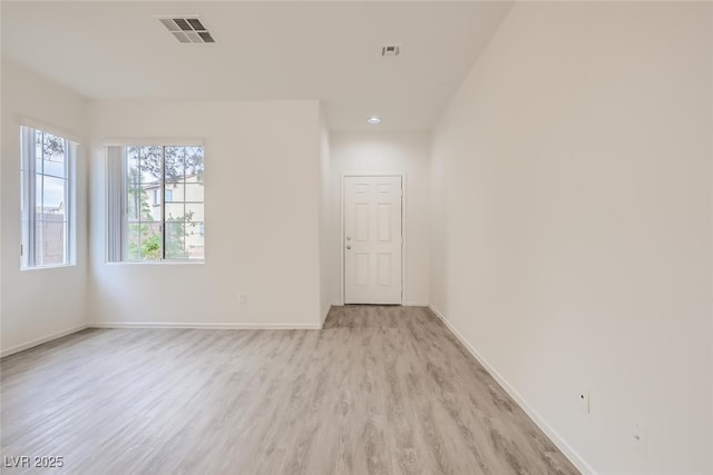 4045 Oliver Sagebrush Dr, Las Vegas, NV 89122 - spare room with baseboards, visible vents, and light wood finished floors
