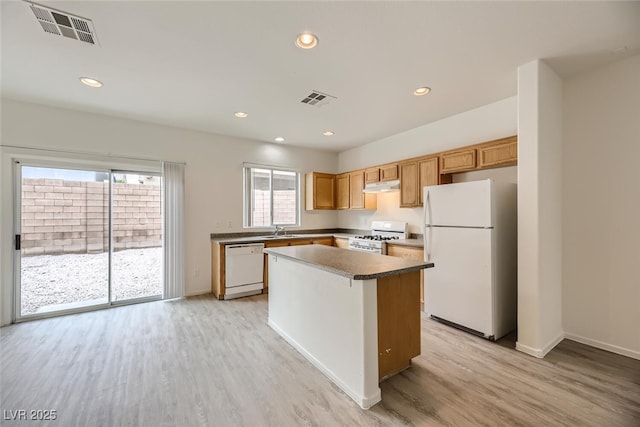 4045 Oliver Sagebrush Dr, Las Vegas, NV 89122 - kitchen featuring a sink, under cabinet range hood, white appliances, and visible vents