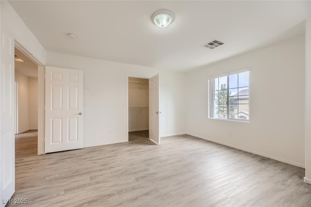 4045 Oliver Sagebrush Dr, Las Vegas, NV 89122 - unfurnished bedroom with baseboards, light wood-style flooring, and visible vents