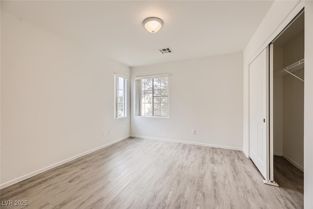 4045 Oliver Sagebrush Dr, Las Vegas, NV 89122 - unfurnished bedroom featuring baseboards, a closet, light wood-style flooring, and visible vents