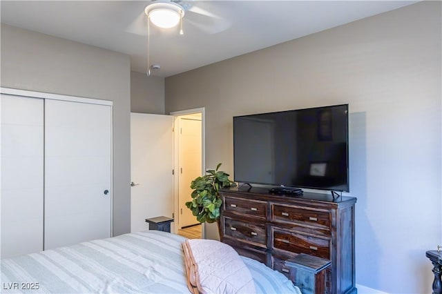 bedroom featuring a ceiling fan and a closet