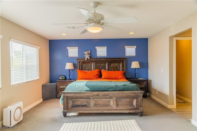bedroom with visible vents, a ceiling fan, carpet, and baseboards