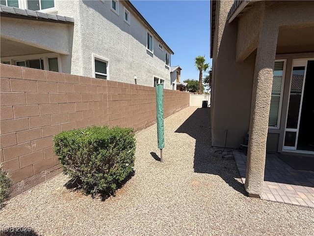 7175 Steubling Glen St, North Las Vegas, NV 89084 - view of home's exterior featuring stucco siding, a fenced backyard, and a patio area