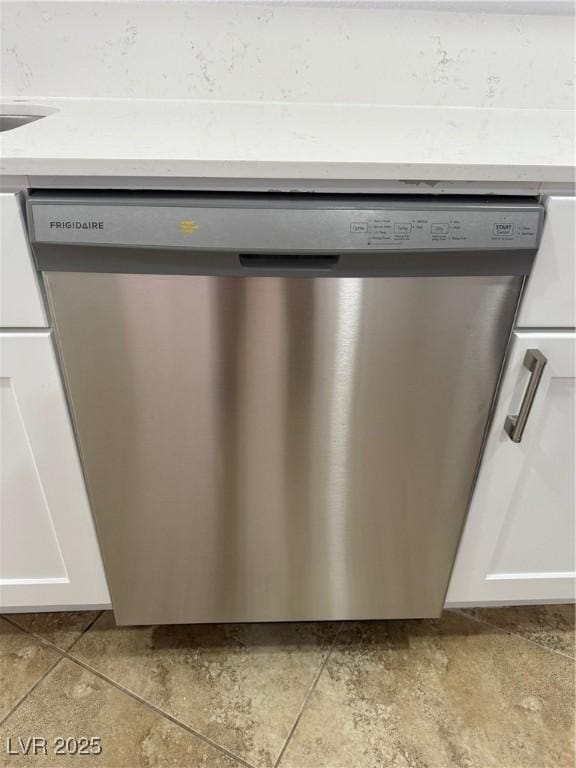 details with stainless steel dishwasher and white cabinets