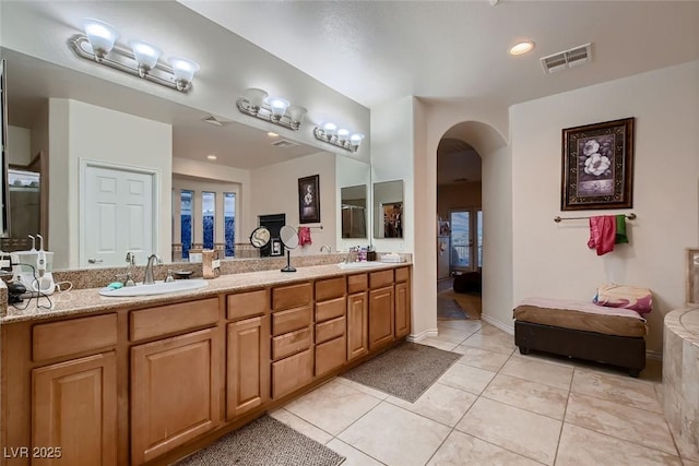 6750 Quapaw St, Las Vegas, NV 89149 - ensuite bathroom featuring a sink, tile patterned flooring, double vanity, and visible vents