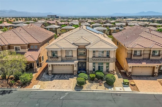 6750 Quapaw St, Las Vegas, NV 89149 - view of front of property featuring a garage, stucco siding, driveway, and a residential view