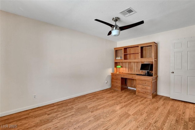 unfurnished office featuring a ceiling fan, baseboards, visible vents, and light wood-style flooring