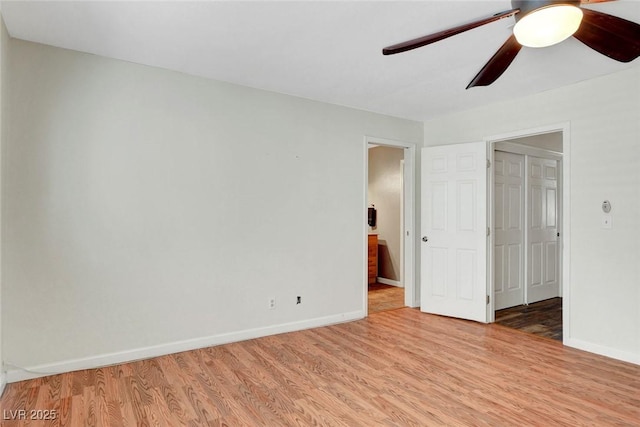 unfurnished bedroom with light wood-style floors, baseboards, and ceiling fan