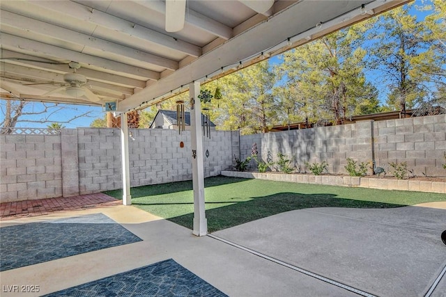 view of patio with a fenced backyard and a ceiling fan