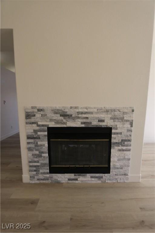 4416 Inez Dr, Las Vegas, NV 89130 - room details with baseboards, wood finished floors, and a fireplace