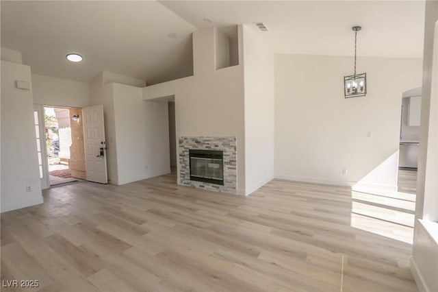 4416 Inez Dr, Las Vegas, NV 89130 - unfurnished living room featuring a chandelier, visible vents, and light wood finished floors