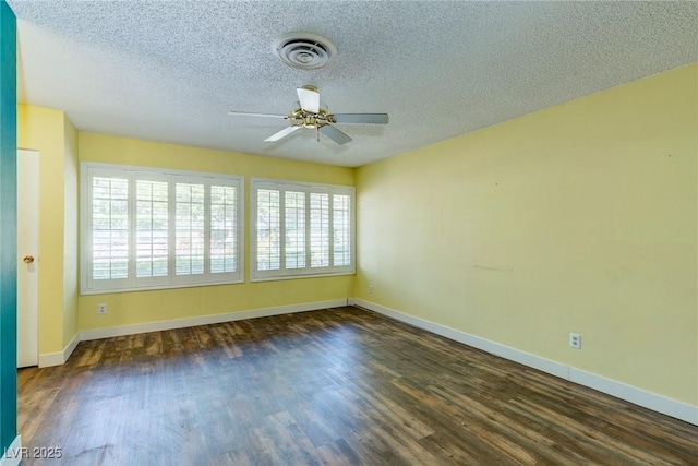 unfurnished room with a ceiling fan, a textured ceiling, visible vents, and wood finished floors