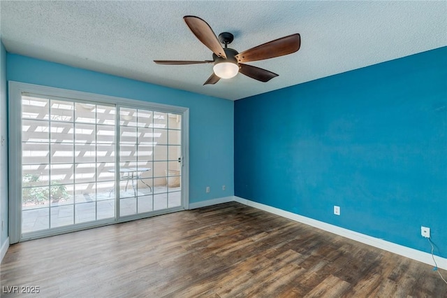 unfurnished room with baseboards, a healthy amount of sunlight, and wood finished floors