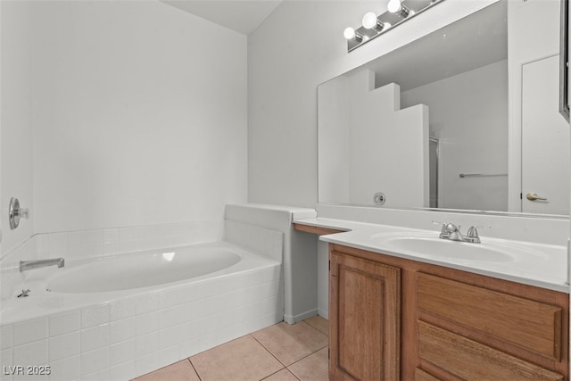 full bathroom with a washtub, tile patterned floors, and vanity