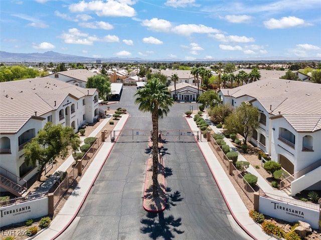 birds eye view of property with a residential view and a mountain view