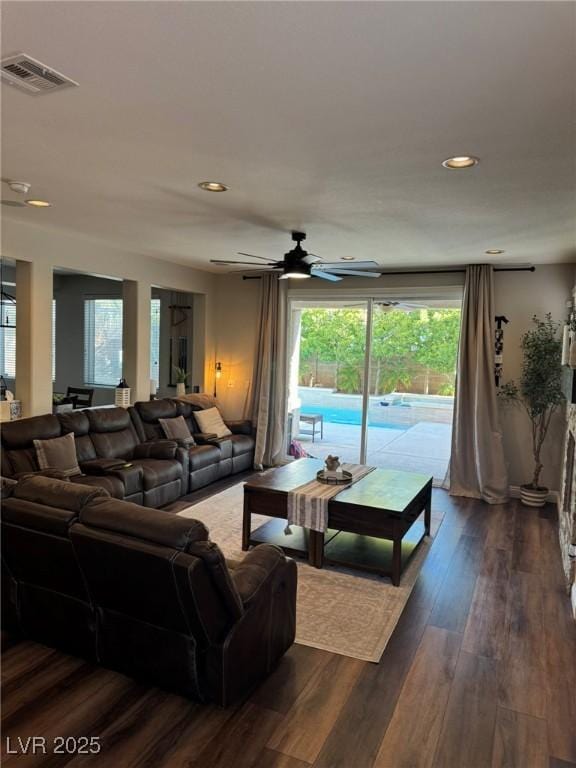 living area with ceiling fan, dark wood-type flooring, recessed lighting, and visible vents